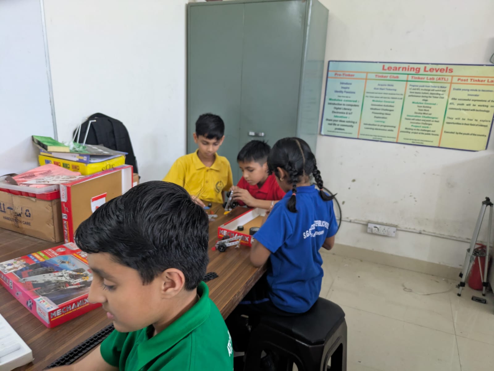 Students working with mechanical kits in a STEM lab